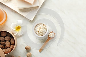 Composition with shea butter on light background