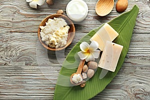 Composition with shea butter on wooden background