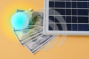 Composition with solar panel, led lamp, money