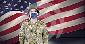 Composition of soldier wearing face mask standing to attention, against waving american flag