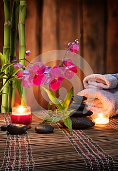 Composition spa massage - bamboo - orchid, towels, candles and black stones