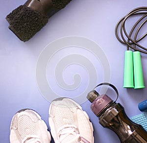 Composition with sport inventory on a blue background. Sport concept flat lay.