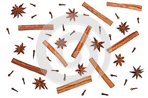 Composition of star anise, cinnamon sticks and clove isolated on white. Abstract pattern flat lay, top view