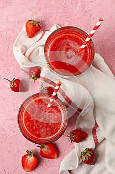 Composition strawberry cocktails on pink table. Summer drink