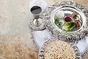 Composition with symbolic Passover, Pesach, items and meal on stone background,