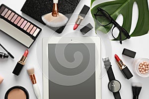 Composition with tablet, makeup products and accessories on white background. Fashion blogger