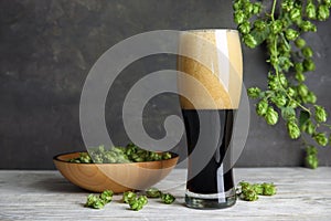 Composition with tasty beer and fresh green hops