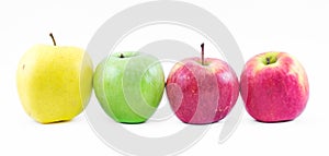 Composition of three types of apples lined up next to each other on a white background - green, yellow and red - still life