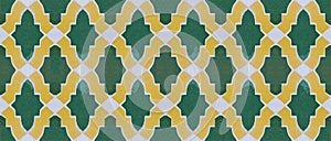 Composition of typical maroccan wall decorations with yellow and green ceramic tiles called azulejos
