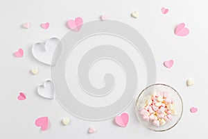 Composition for Valentine`s Day February 14th. Delicate composition of pink hearts made of paper and heart-shaped