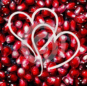 Composition for Valentine`s Day with pomegranate seeds and paint