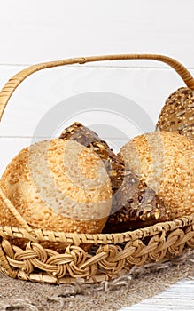 Composition with variety of buns baking products on wooden table