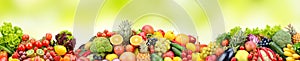 Composition variety fresh fruits and vegetables on green background