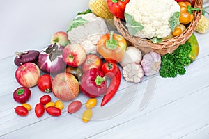 Composition with variety of fresh organic vegetables on white