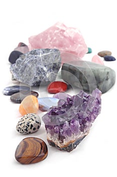 Different kinds of crystals on white background