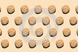 Composition with walnuts pattern on light brown background