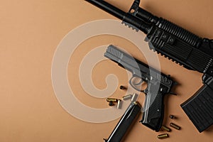 Composition with weapon on beige background top view