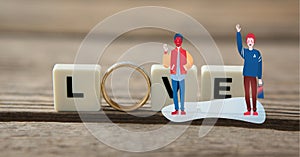 Composition of wedding ring and love text on squares with illustration of people