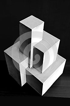 Composition of white cubes on black background