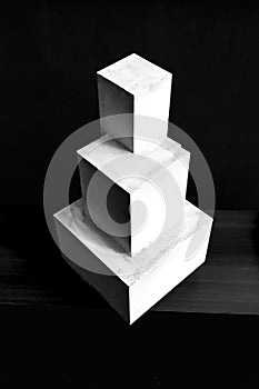 Composition of white cubes on black background