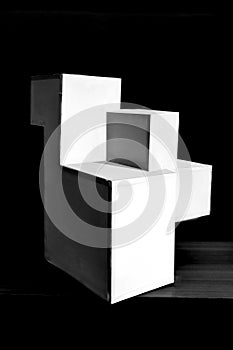 Composition of white cubes on black background