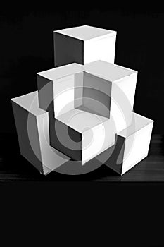 Composition of white cubes on black background