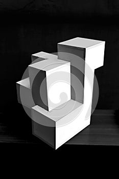 Composition of white cubes on black background