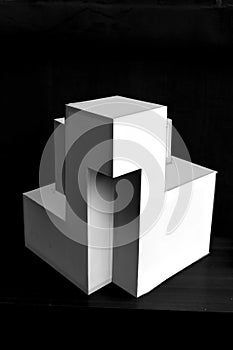 Composition of white cubes on black background