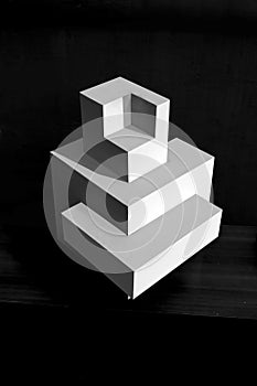 Composition of white cubes on black background