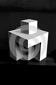 Composition of white cubes on black background