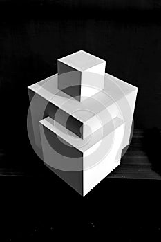 Composition of white cubes on black background