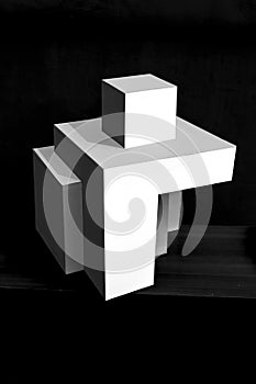 Composition of white cubes on black background