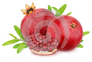 Composition with whole and cutted pomegranates with leaves isolated on white background. As design element.