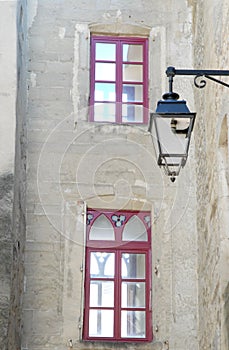 Composition of windows and a street lamp in Valence in France