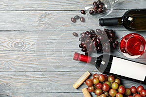 Composition wine and grape on wooden background, space for text