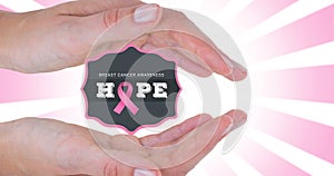 Composition of woman and hope text with breast cancer awareness slogan over pink background