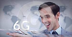 Composition of the word 6g over caucasian man smiling with world map in background