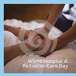 Composition of world hospice and palliative care day text over holding hands
