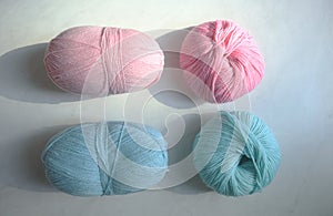 Composition with yarn balls on light blue background