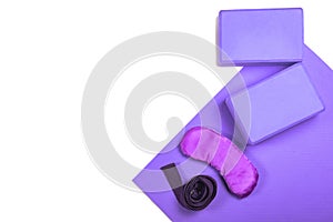 Composition of yoga, meditation or pilates accessories on white background with copyspace.