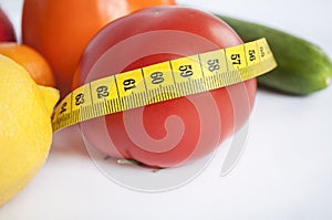 Compositions of ripe vegetables and fruits: tomato, lemon, persimmon, cucumber and tangerine