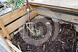 Compost bin with fork photo