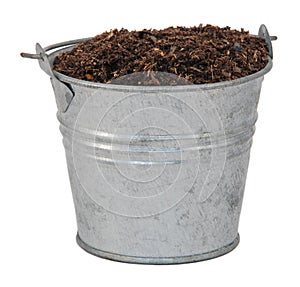 Compost / soil / dirt in a miniature metal bucket