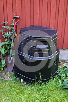 A compost standing beside a wall photo