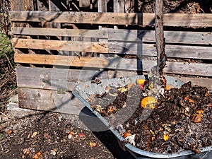 Composter in the garden made of wood