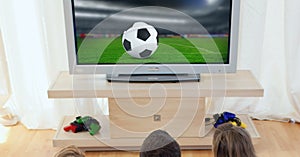 Compostion of group of children watching football match on tv at home