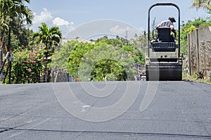 Compressing Asphalt On Roadway