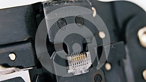 Compression of the Internet connector using a crimper for crimping RJ 45. Internet Network Connector, rj45.Crimping of a unified c