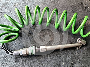 THE COMPRESSOR AIR HOSE DRIVES AIR TO THE TIRE.