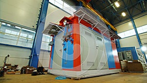 Compressor substation with metal doors in plant workshop